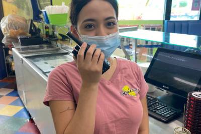 ice cream shop worker uses business radio