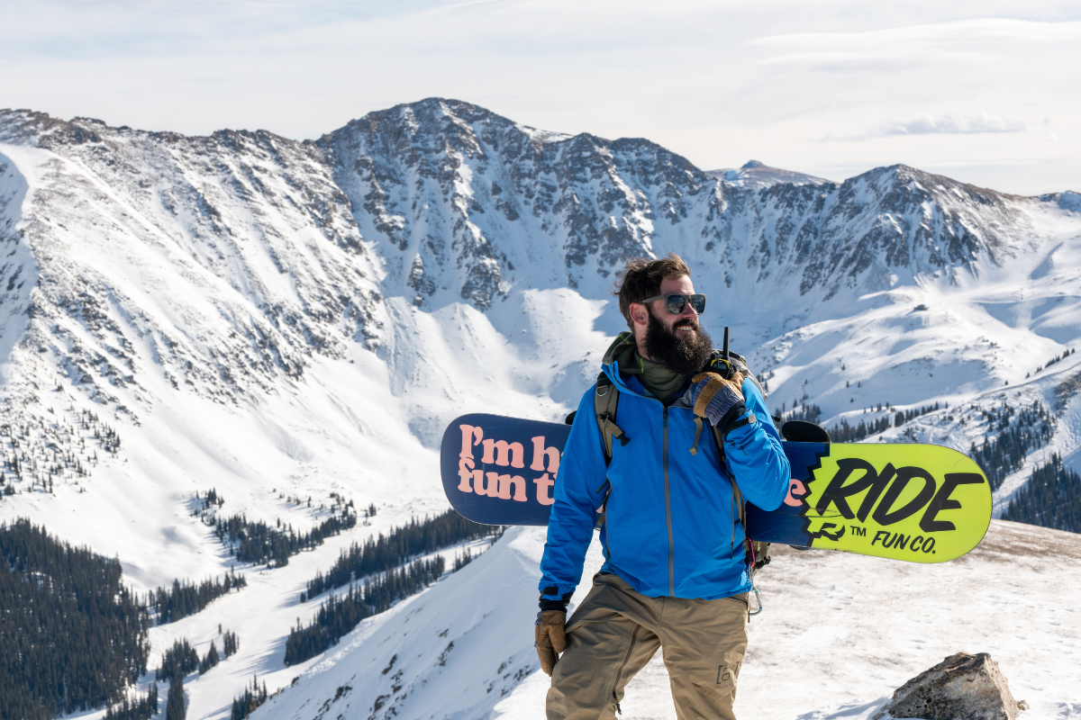man on snowy mountain with walkie talkie