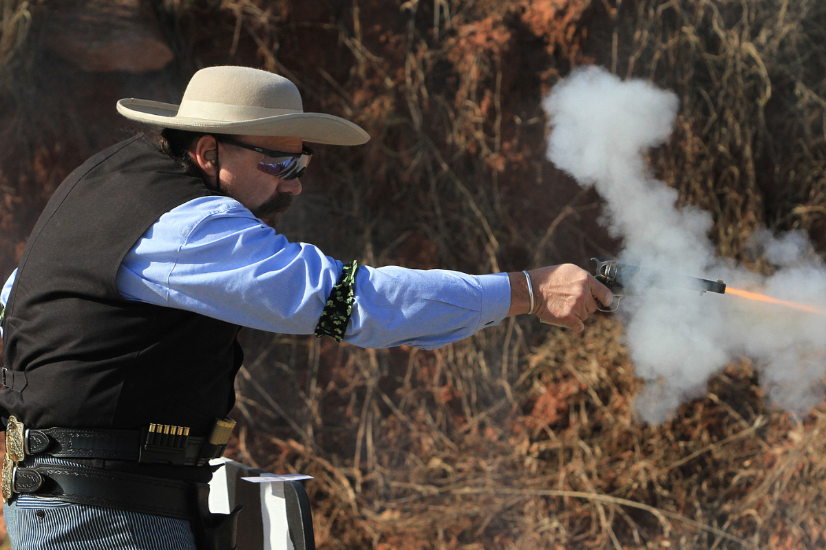 man fires gun