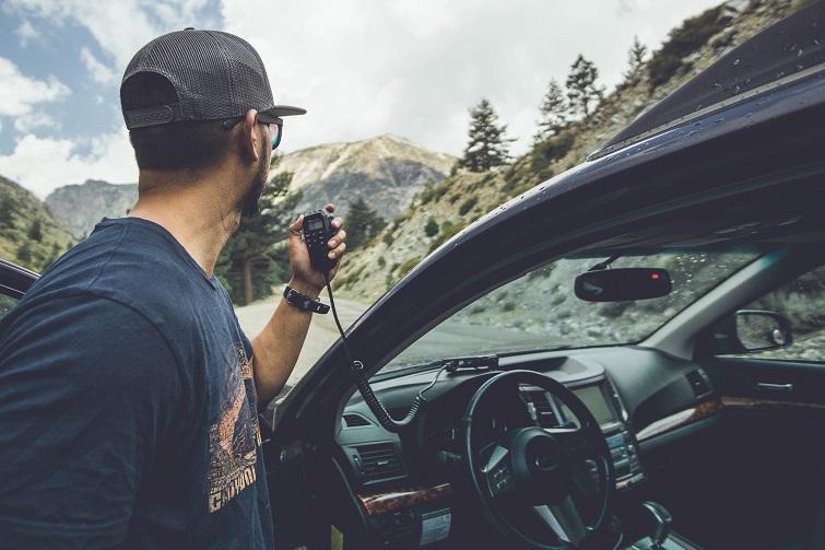 man uses MicroMobile mic outside vehicle