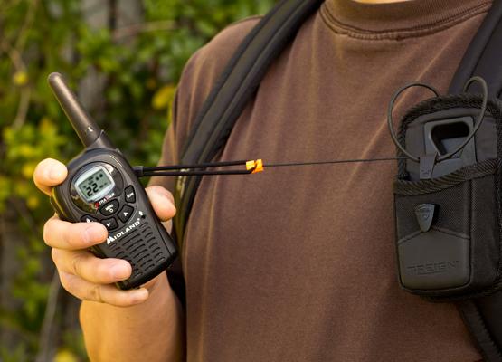 man holds walkie talkie