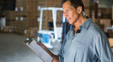 warehouse manager on walkie talkie comms