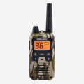 A Midland walkie-talkie with a camouflage pattern in beige, brown, and black, featuring a black antenna and an orange LCD display showing '36'.